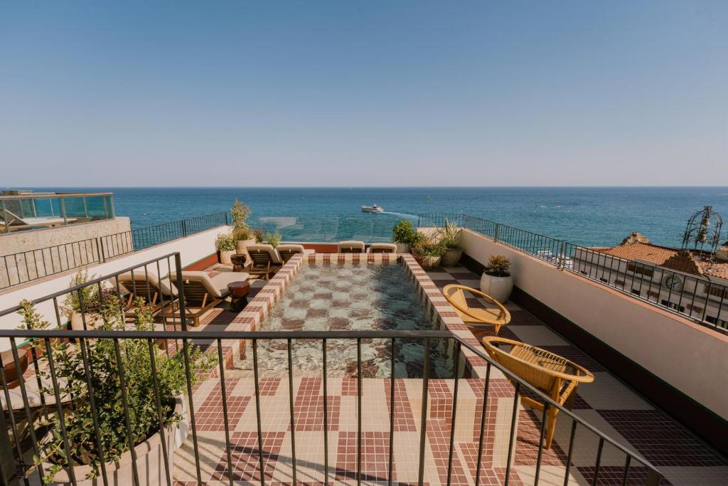 a balcony with a view of the ocean at Suites by Miramar - Adults only in Lloret de Mar