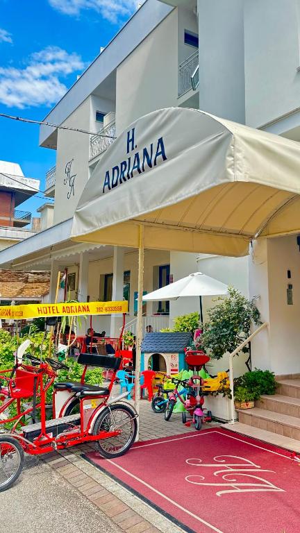 a group of bikes parked in front of a building at Hotel Adriana in Bellaria-Igea Marina