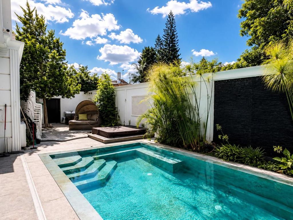 a swimming pool in the backyard of a house at סוויטת נווה in Pardes H̱anna