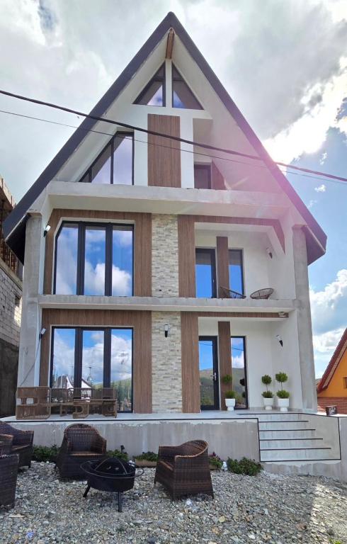 a rendering of a house with a pointed roof at Cabana Bogdan Rânca in Ranca