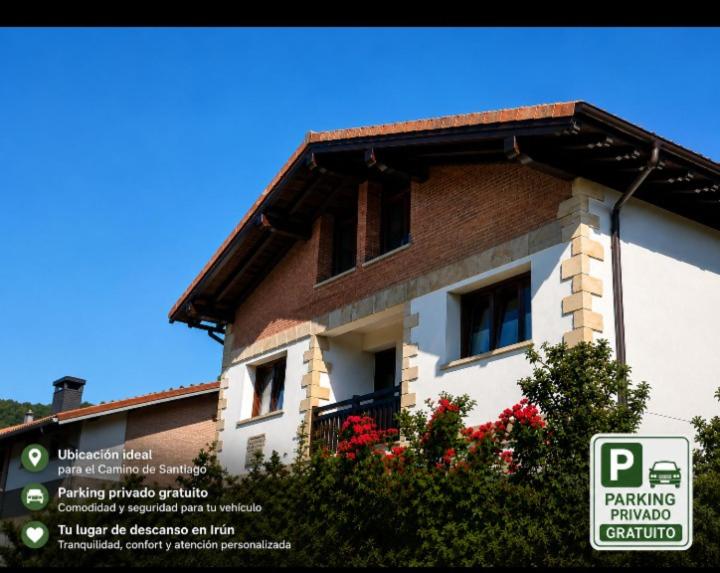 a house with a parking sign in front of it at Casa Iparra Txiki Berri in Irún