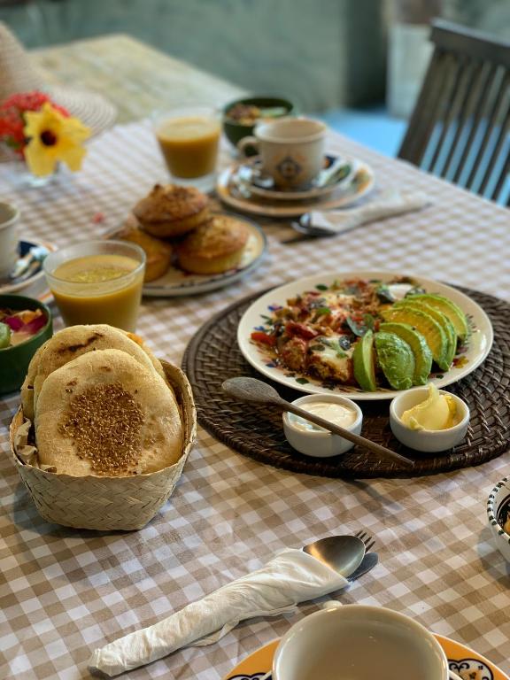 a table with a plate of food on a table at Domingas in Ilha de Boipeba