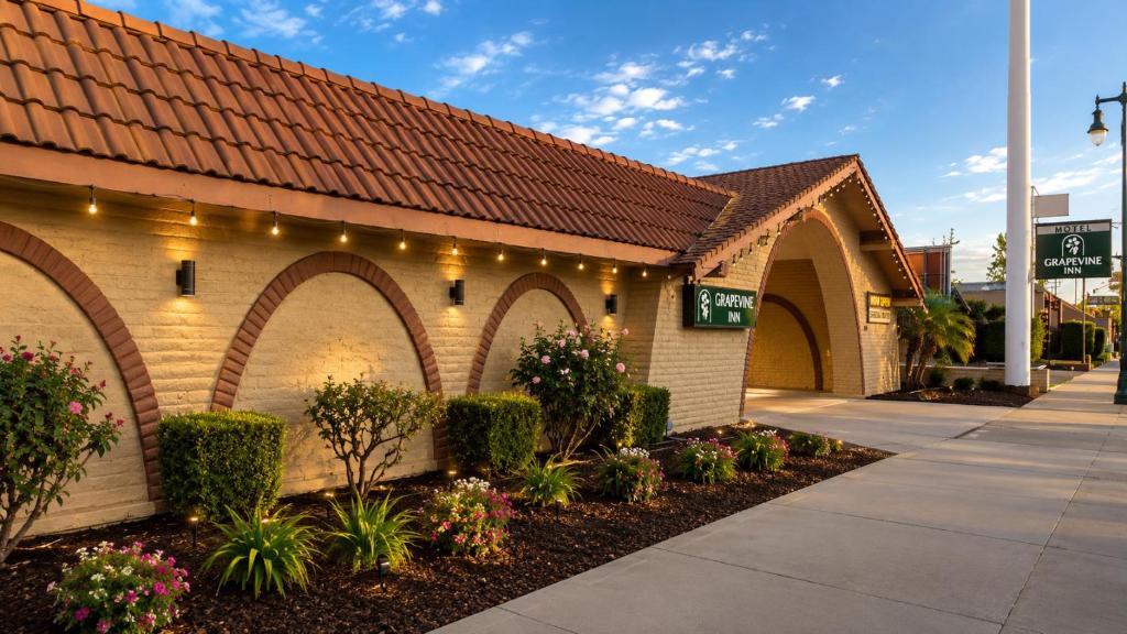 a building with arches with lights on it at Grapevine Inn in Lodi