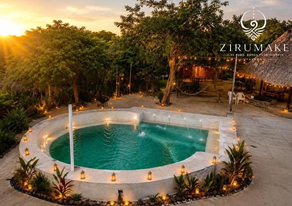 a swimming pool in the middle of a yard at Zirumake Tayrona Dentro del Parque Tayrona in El Zaino