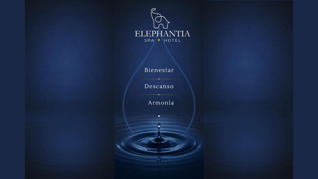a bottle of wine with a drop of water at Elephantia Spa Hotel in Villa de Leyva