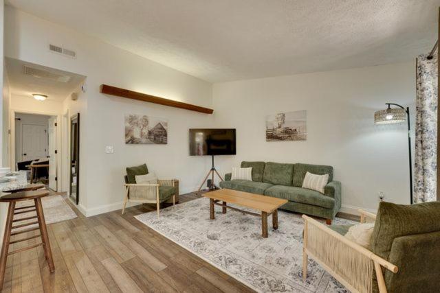 a living room with a couch and a table at Ozark Mountain Refuge in Kimberling City