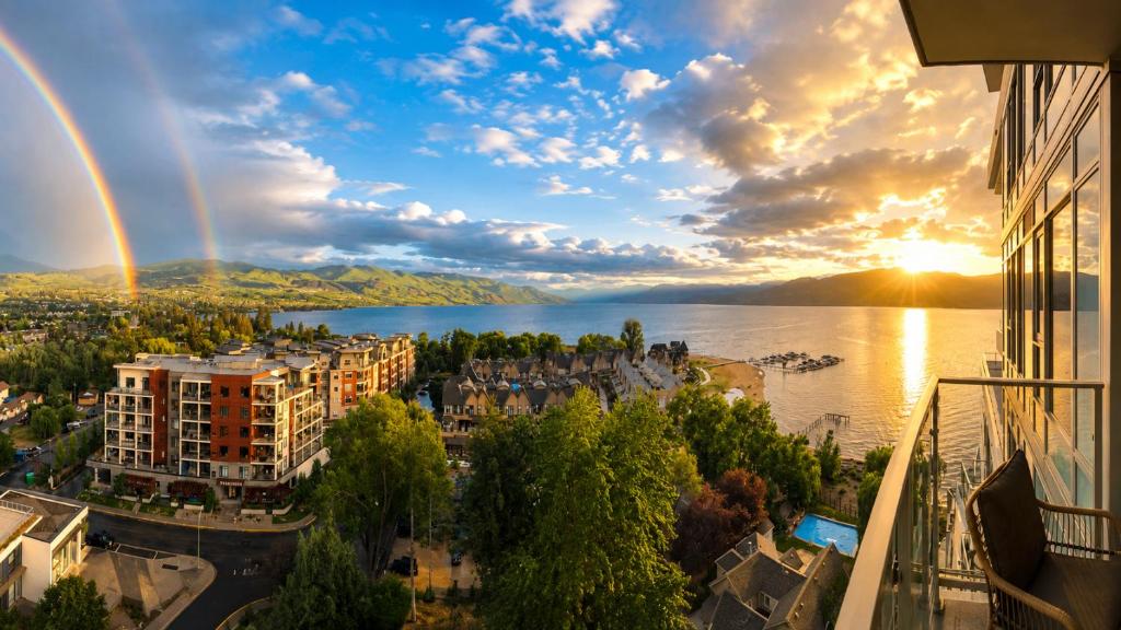 a view of a city and a lake at sunset at Paradise on the Lake in Kelowna