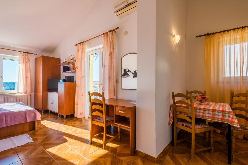 Postel nebo postele na pokoji v ubytování Apartment Majoran