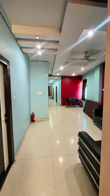 a room with a hallway with a couch in it at Hotel shree govind in Orai
