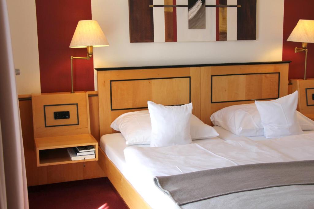 Postel nebo postele na pokoji v ubytování Hotel Riezler Hof