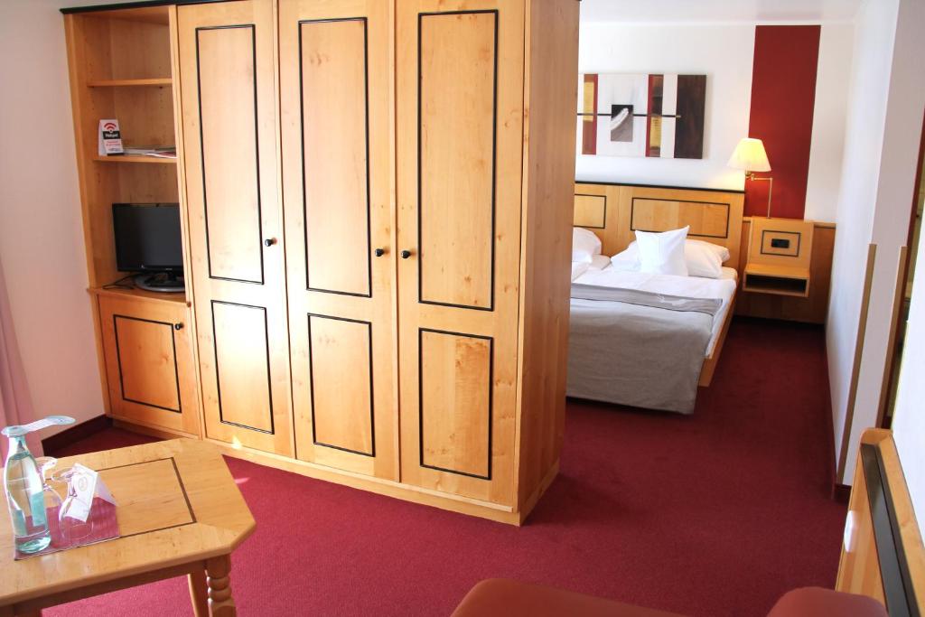 Postel nebo postele na pokoji v ubytování Hotel Riezler Hof