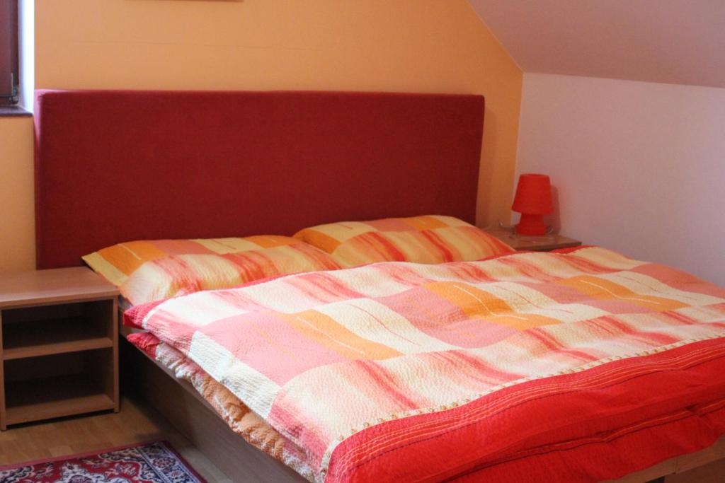 A bed or beds in a room at Penzion Rosnicka Liesek