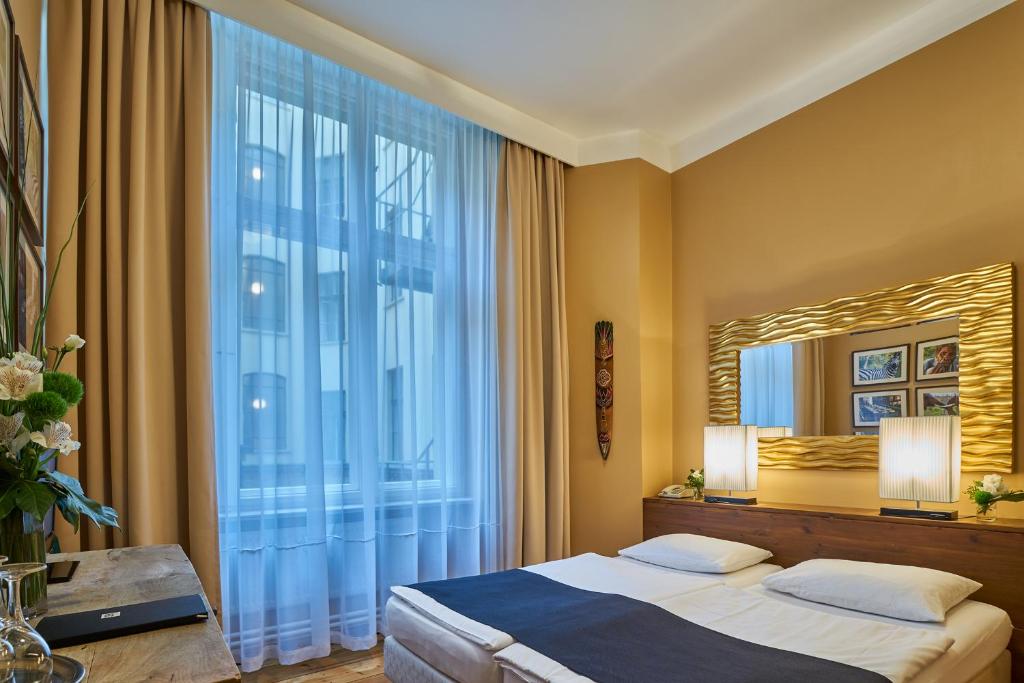 Postel nebo postele na pokoji v ubytování Hotel 38