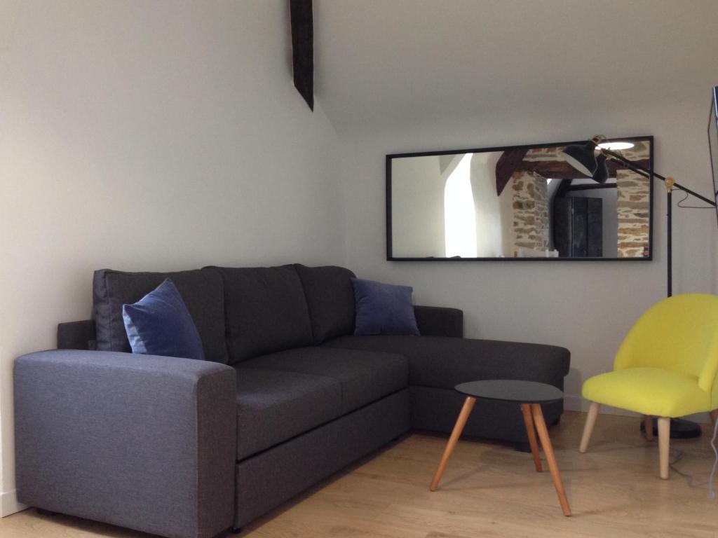 Posezení v ubytování Le Duplex des Eclusiers