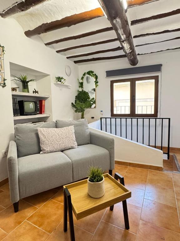 a living room with a couch and a table at Villa Rueda in Moratalla