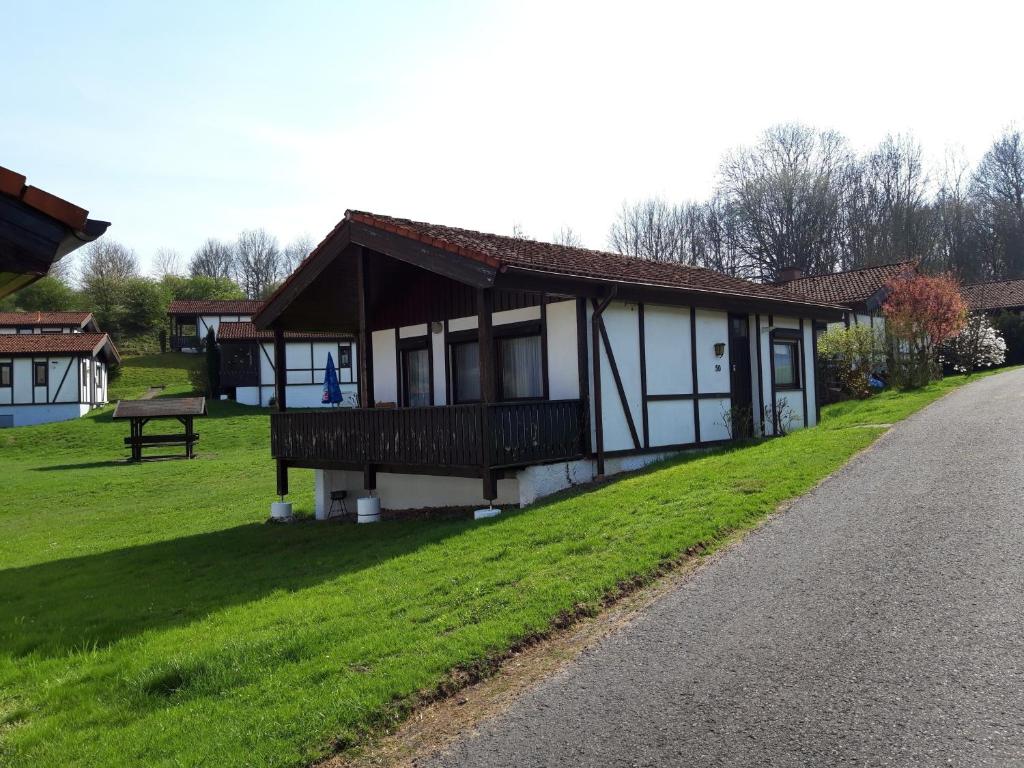 a house on the side of a road at Schmuckkästchen Bungalow 50 in Dipperz