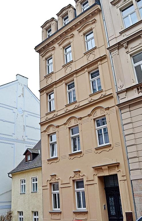 a tall building with windows on the side of it at Moravská 15 Apartments in Karlovy Vary