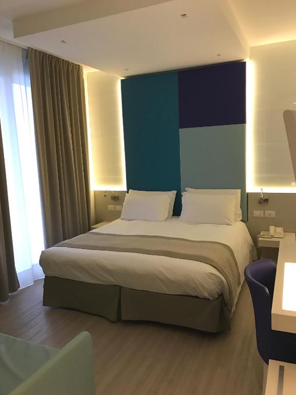 Postel nebo postele na pokoji v ubytování Hotel Colombo