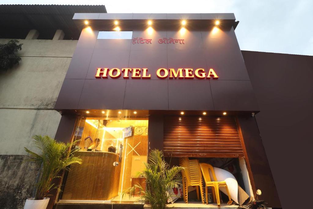 a hotel omza with a sign on the front of it at Hotel Omega in Mumbai