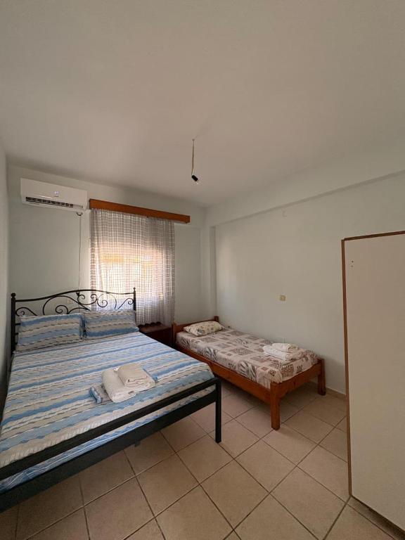 a bedroom with two beds in a room at Eden Apartments in Qeparo