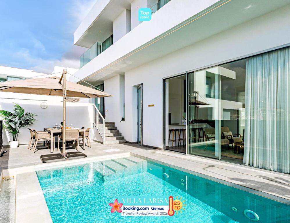 a villa with a swimming pool and a dining area at Villa Larisa - private heated pool, chill out and BBQ in Callao Salvaje