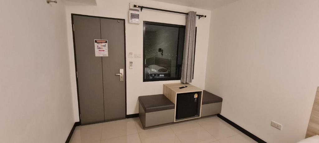 a room with a box in the corner of a room at ห้องพักรายวัน168 in Ban Amphaeng