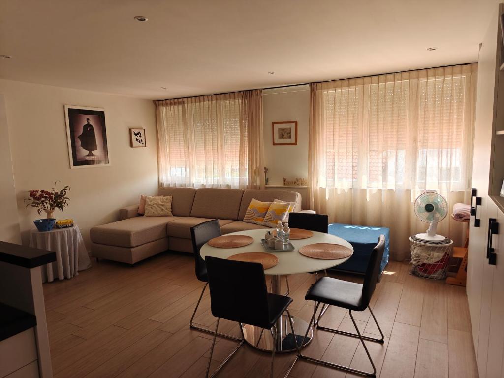 a living room with a table and a couch at Christina in Nieuwpoort