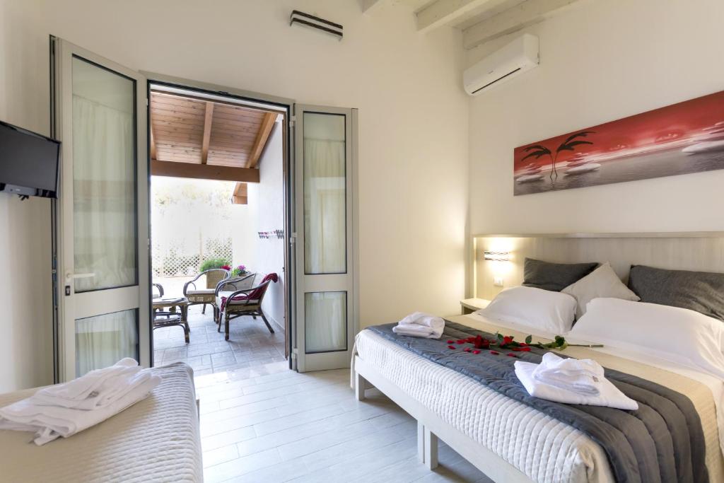 Postel nebo postele na pokoji v ubytování Agriturismo Il Megalite