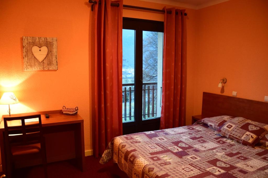 Postel nebo postele na pokoji v ubytování Hotel Bellevue
