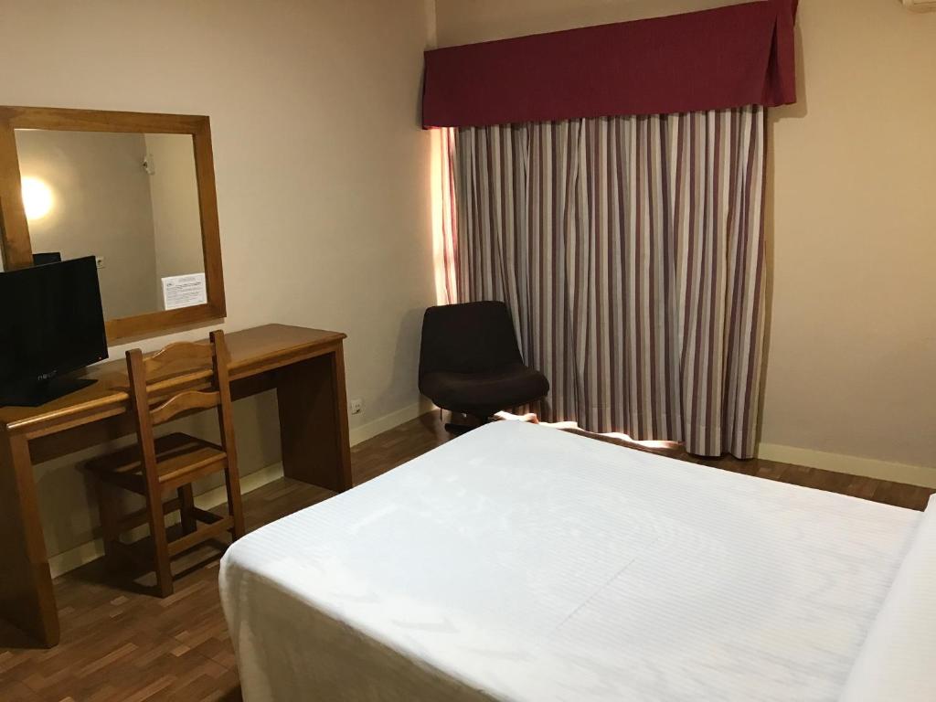 TV a/nebo společenská místnost v ubytování Hotel Anfora
