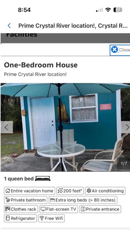 a page of a website with a table in front of a house at The conch cottage in Crystal River