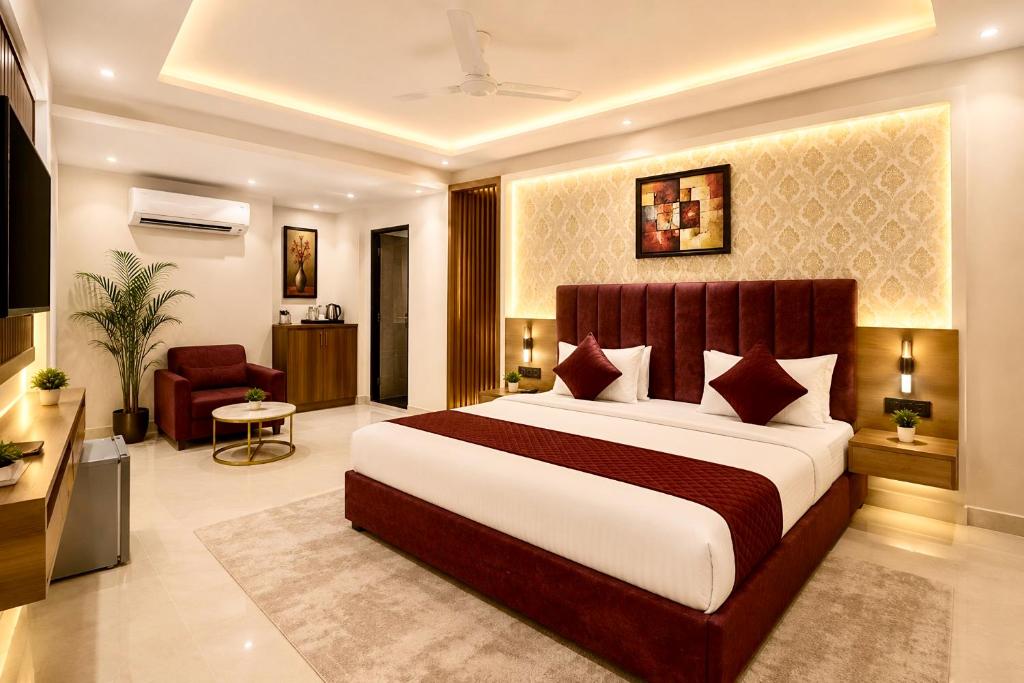 a bedroom with a large bed in a room at Hotel Perfectionist- Free Airport Pickup in New Delhi