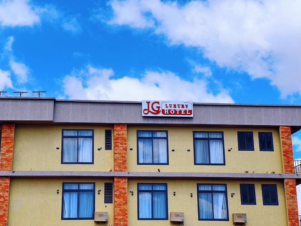 a front of a hotel with a sign on it at JG Luxury Hotel in Dodoma