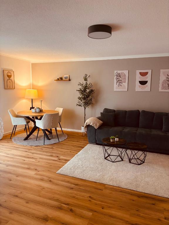 a living room with a couch and a table at Ferienwohnung De Lorenzi in Boppard