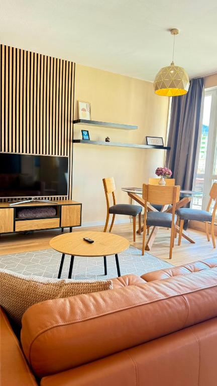 a living room with a couch and a table at Apartment Mira in Ružomberok