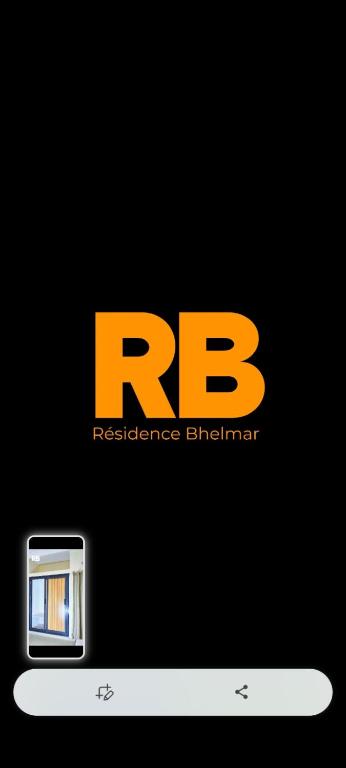 a yellow rg logo on top of a cell phone at RÉSIDENCES Bhelmar in Abomey