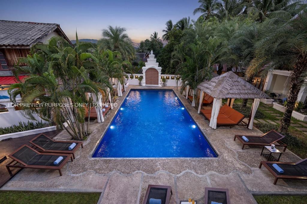 an image of a swimming pool at a resort at La palm Luang prabang in Luang Prabang