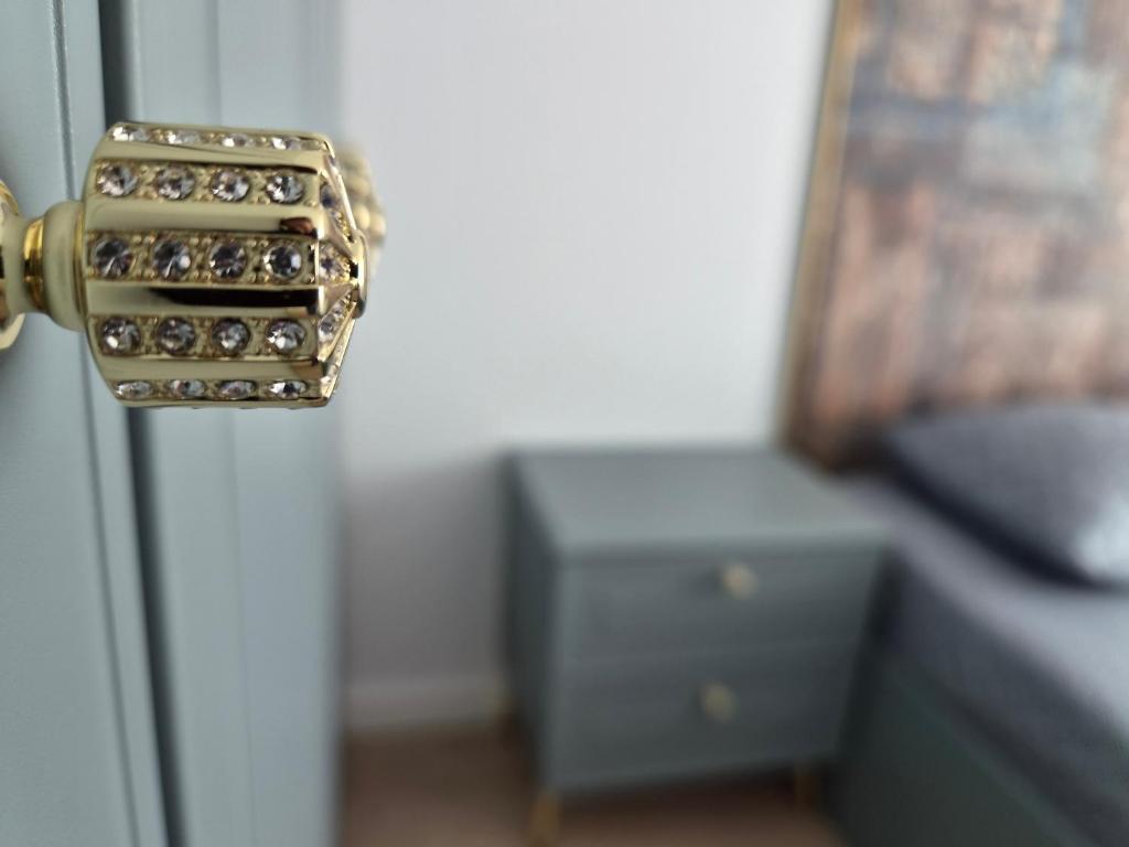 a door with a bunch of diamonds on it at Apartament Nagiulia in Oradea
