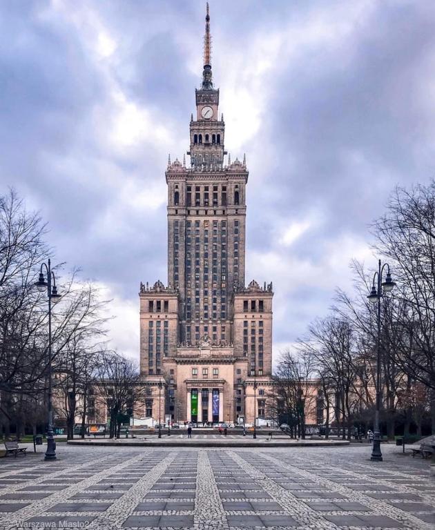 a large building with a clock tower on top of it at InCentrum Pańska 3 in Warsaw