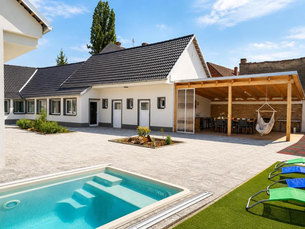 a house with a swimming pool and a patio at Chalupa Jaroslavice in Jaroslavice
