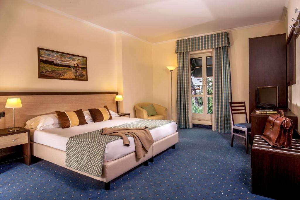 Postel nebo postele na pokoji v ubytování Resort La Rocchetta