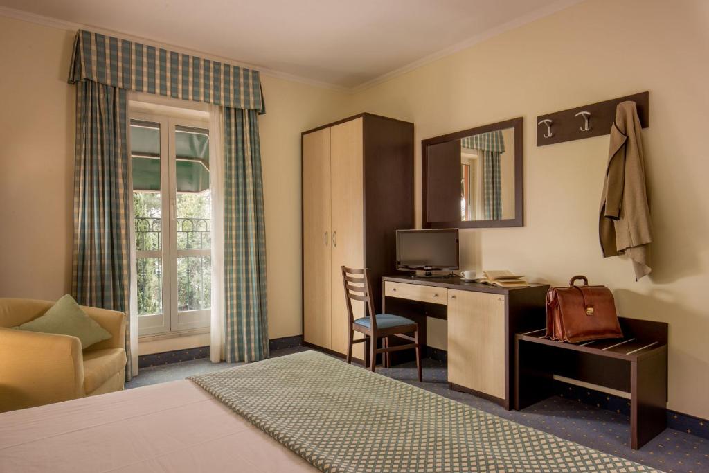 Postel nebo postele na pokoji v ubytování Resort La Rocchetta