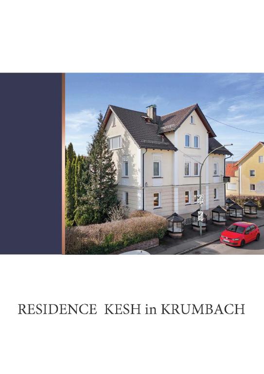 a large white house with a red car in front of it at Residence KESH in Krumbach