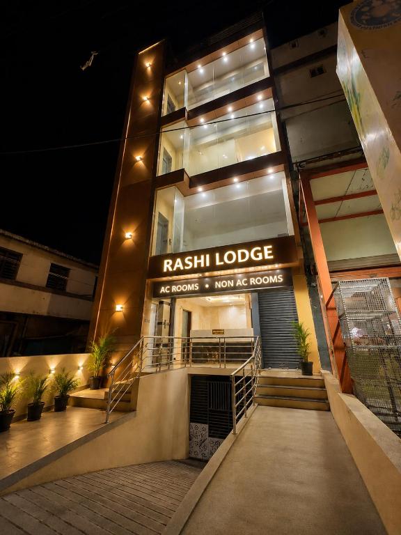 a facade of a train lodge at night at RASHI Lodge Attibale in Attibele