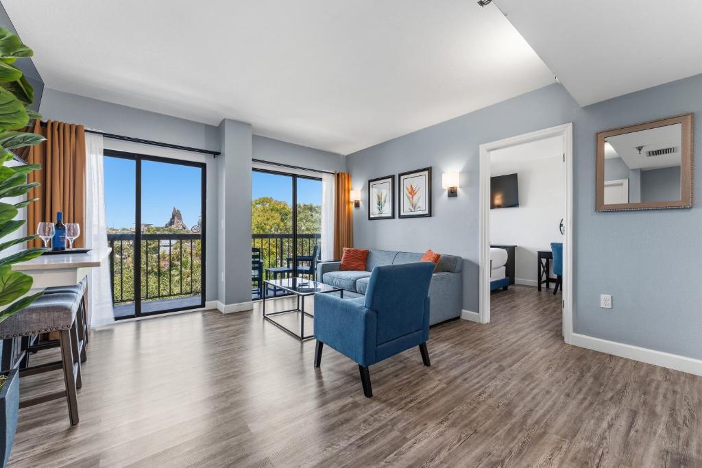 a living room with a couch and a table at Volcano View 2 Bed 2 Bath Condo with Balcony in Orlando