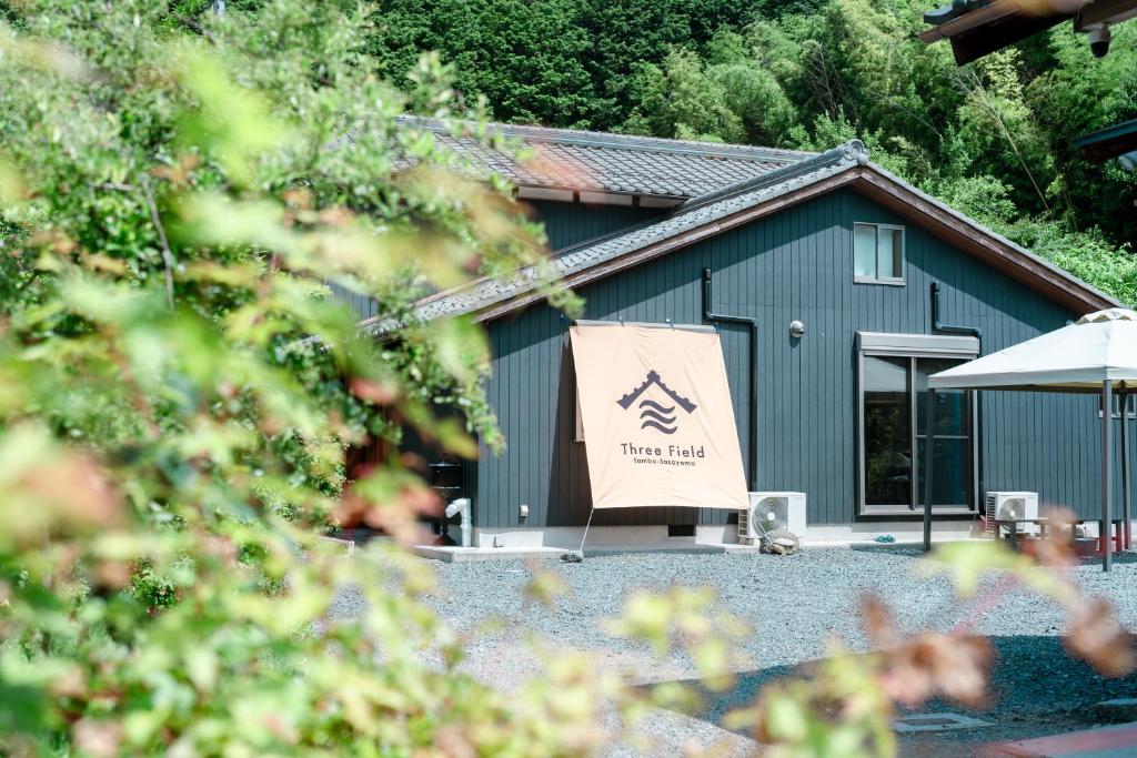 a building with a sign in front of it at 1日1組限定 一棟貸し Japanese Traditional House Three Field Tamba-Sasayama in Sasayama