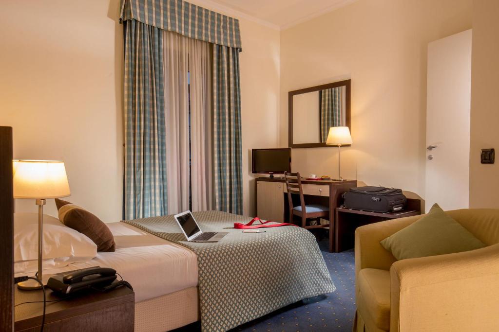 Postel nebo postele na pokoji v ubytování Resort La Rocchetta
