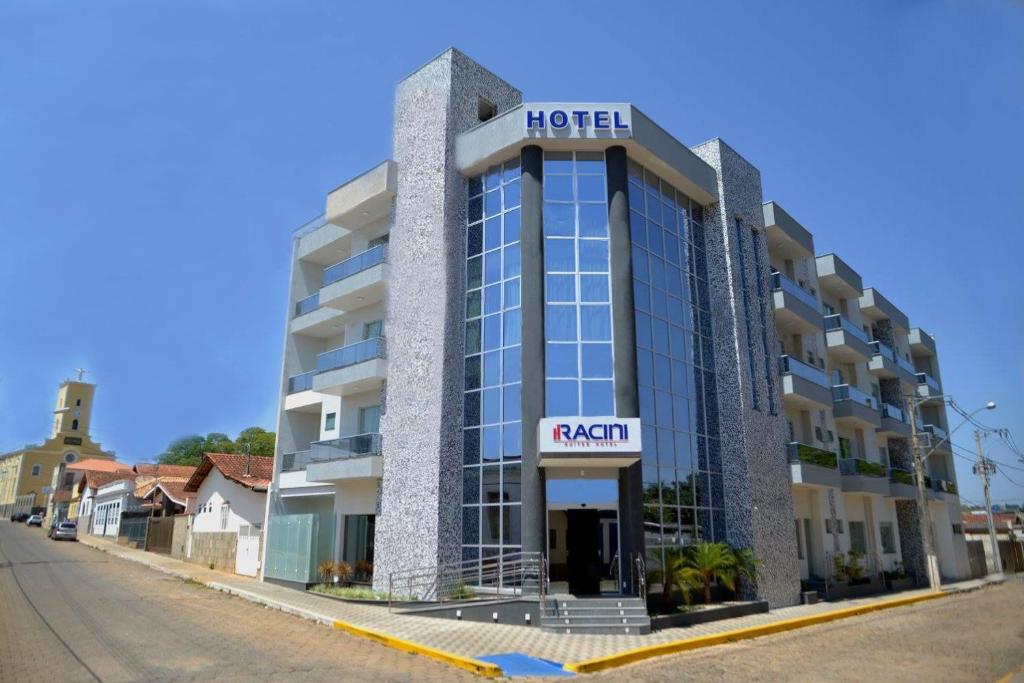 a hotel on the side of a street at Racini Suites Hotel in Boa Esperança