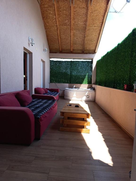 a living room with a couch and a table at Velin raj in Soko Banja