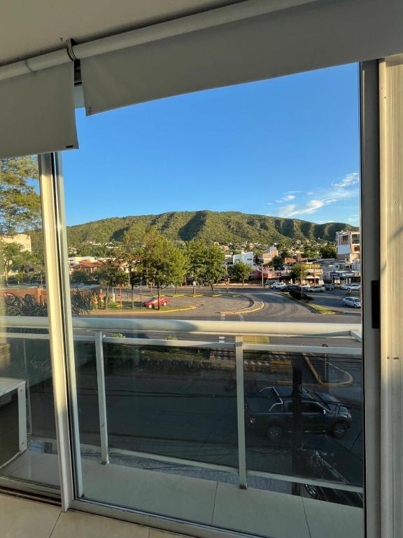 a window in a building with a view of a street at Carilo in Villa Carlos Paz
